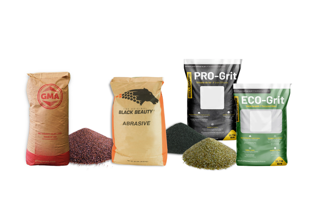 Labeled abrasive media bags from GMA, Black Beauty, and Bellemare (PRO-Grit and ECO-Grit) with corresponding abrasive piles in front of each bag.
